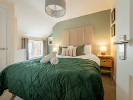 A bedroom with a bed and nightstand at 127 Columbus Ravine in Scarborough