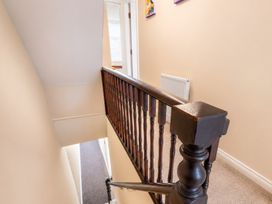 A staircase with a banister and a radiator at 127 Columbus Ravine Scarborough