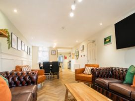 A living room with sofas and a table at 127 Columbus Ravine in Scarborough