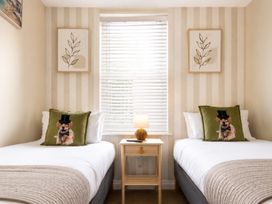 A bedroom with two beds and decorative pillows at 127 Columbus Ravine Scarborough