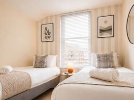 A bedroom with two beds and a window at 127 Columbus Ravine, Scarborough
