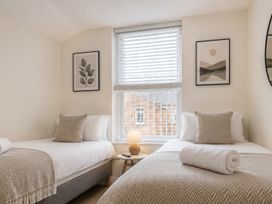 A bedroom with two beds and a lamp at 127 Columbus Ravine in Scarborough