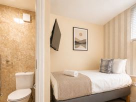 A bedroom with a single bed and a bathroom at 127 Columbus Ravine, Scarborough