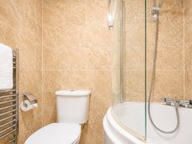 A bathroom with a shower and toilet at 127 Columbus Ravine in Scarborough