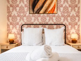 A bedroom with a bed and decorative pillows at 127 Columbus Ravine in Scarborough
