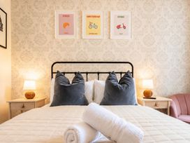 A bedroom with a bed and art on the wall at 127 Columbus Ravine, Scarborough