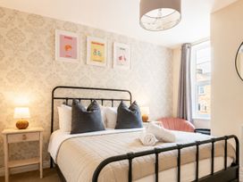 A bedroom with a bed and decorative posters at 127 Columbus Ravine in Scarborough