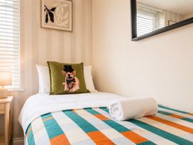 A bedroom with a bed and decorative pillow at 127 Columbus Ravine Scarborough