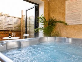 A hot tub with glasses and champagne in an indoor spa at 127 Columbus Ravine Scarborough