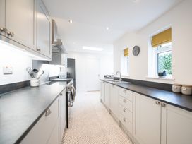 A kitchen with cabinets and appliances at 23 Trafalgar Road Scarborough