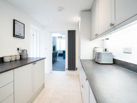 A kitchen with cabinets and appliances at 23 Trafalgar Road, Scarborough