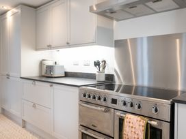 A kitchen with cabinets and stove at 23 Trafalgar Road, Scarborough