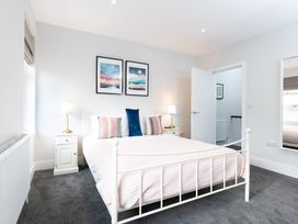 A bedroom with a bed and nightstand at 23 Trafalgar Road in Scarborough