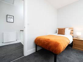 A bedroom with a bed and a bedside table at 23 Trafalgar Road in Scarborough