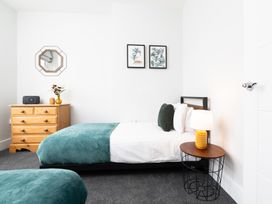 A bedroom with a bed and bedside table at 23 Trafalgar Road, Scarborough