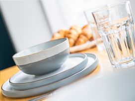 A bowl, plate, and glass on a table at 53A Hampton Road Scarborough