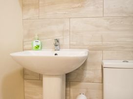 A sink and toilet in a bathroom at 53 Hampton Road Scarborough