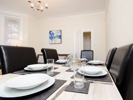A dining room with a set table at 46 Ashville Avenue Scarborough
