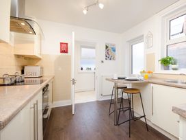 A kitchen with a stove and countertop at 46 Ashville Avenue, Scarborough