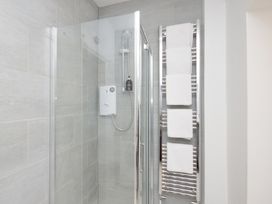 A shower with towels on a rack at 46 Ashville Avenue, Scarborough