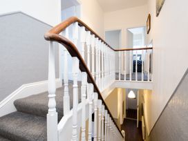 A staircase with wooden railing at 46 Ashville Avenue Scarborough