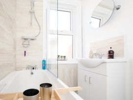 A bathroom with bathtub and sink at 46 Ashville Avenue Scarborough