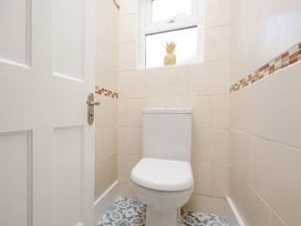 A bathroom featuring a toilet and a window at 46 Ashville Avenue, Scarborough