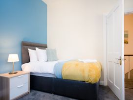 A bedroom with a bed and a bedside table at 46 Ashville Avenue Scarborough