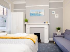 A bedroom with a bed and a wardrobe at 46 Ashville Avenue in Scarborough