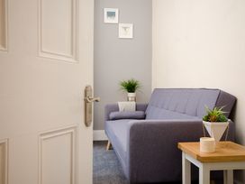 A snug with a sofa and a table at 46 Ashville Avenue Scarborough
