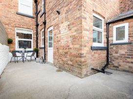 A patio area with a table and chairs at 46 Ashville Avenue Scarborough