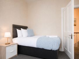 A bedroom with a bed and bedside table at 46 Ashville Avenue Scarborough