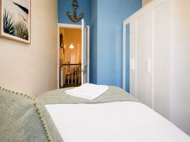 A bedroom with a bed and wardrobe at 46 Ashville Avenue Scarborough
