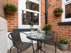An outdoor seating area with a table and chairs at 46 Ashville Avenue Scarborough