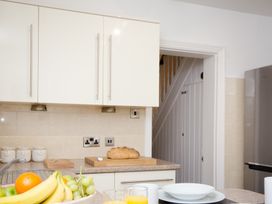 A kitchen with cabinets and a countertop at 46 Ashville Avenue Scarborough
