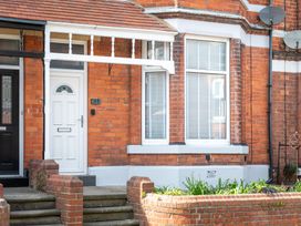 A front entrance with a white door and brick steps at 22 Ashville Avenue in Scarborough