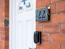 A house number plaque and door at 22 Darcey House in Scarborough