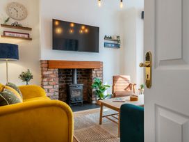 A living room with a television and fireplace at 22 Ashville Avenue Scarborough
