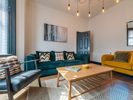 A living room with sofas and a coffee table at 22 Ashville Avenue in Scarborough