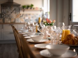A dining table set with bowls and glasses at 22 Ashville Avenue in Scarborough