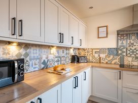 A kitchen with countertops and appliances at 22 Ashville Avenue in Scarborough