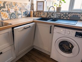 A kitchen with a sink and dishwasher at 22 Ashville Avenue Scarborough