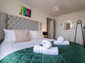 A bedroom with a bed and pillows at 22 Ashville Avenue Scarborough