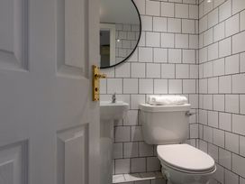A bathroom with sink and toilet at 22 Ashville Avenue in Scarborough
