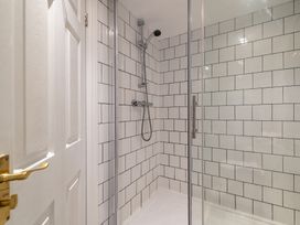 A shower with glass door in a bathroom at 22 Ashville Avenue Scarborough