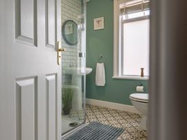 A bathroom with a shower and sink at 22 Ashville Avenue, Scarborough