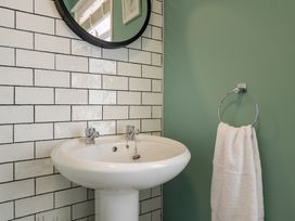 A bathroom with a sink and mirror at 22 Ashville Avenue, Scarborough