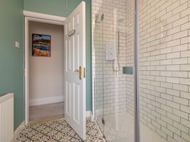 A bathroom with a shower and wall art at 22 Ashville Avenue Scarborough