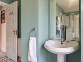 A bathroom with a sink and mirror at 22 Ashville Avenue in Scarborough