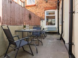 An outdoor area with a table and chairs at 22 Ashville Avenue Scarborough